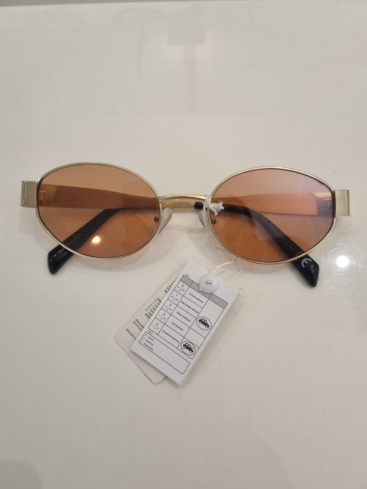 Goldene ovale Sonnenbrille mit braunen Gläsern