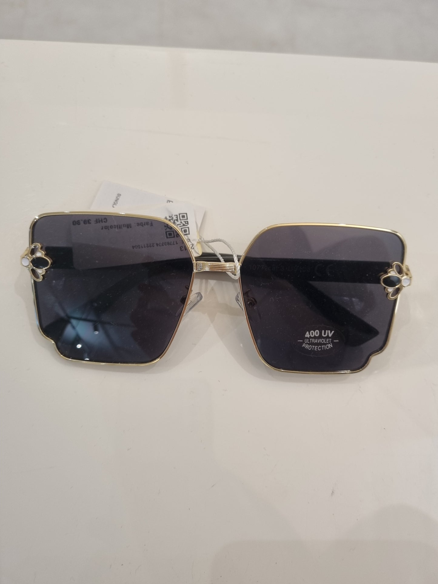 Goldene eckige Sonnenbrille mit Kristall-Details