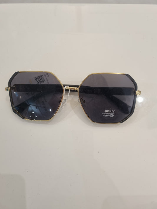 Geometrische Goldene Sonnenbrille mit schwarzen Gläsern